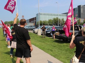 Unionized workers listen in at a noon rally at Cornwall Community Hospital, with speakers including Louis Rodrigues and Diane Pecore. Photo on Monday, August 9, 2021, in Cornwall, Ont. Todd Hambleton/Cornwall Standard-Freeholder/Postmedia Network