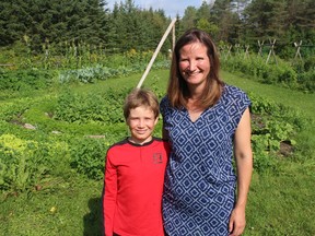 Family Earth founder Rochelle Johnston, with her nine-year-old son Kai, at the ecological market garden. Photo on Friday, August 13, 2021, in Gallingertown, Ont. Todd Hambleton/Cornwall Standard-Freeholder/Postmedia Network