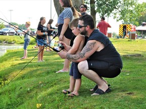 Justin Labrecque was busy showing is step-son Maverick Brahant how to fish during this year's Fishing for Autism event on Saturday August 21, 2021 in Alexandria, Ont. Francis Racine/Cornwall Standard-Freeholder/Postmedia Network
