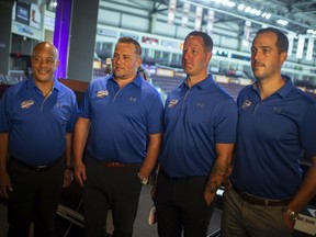 Ex-Sarnia Sting player and coach Andy Delmore, second from right, joined the Windsor Spitfires on Tuesday, Aug. 24, 2021, to join the staff with, from left, goalie coach Perry Wilson, head coach Marc Savard and associate coach Jerrod Smith. PHOTO BY DAX MELMER /Windsor Star