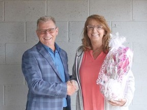 Mayor Chris Warwick welcomes Cherie Whitney , owner of Sweet Tooth Candy Bouquets, to the Hanna Business Community on Aug. 20 at the Hanna Business Hub. Misty Hart Photo
