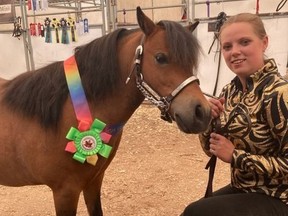 Taylor Hynds-Howe and her “heart horse” Buffy after winning the High halter obstacle at the Canadian miniature horses club competition in Olds, Alta..