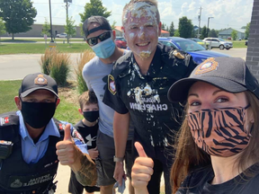 Members of the Saugeen Shores Police Service team that entered the Gran Fondo Lake Huron pose for a photo Sunday after police chaplain Pastor David Baker took a pie in the face for raising the most money for the team. SUPPLIED