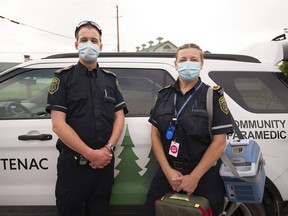 Jason Kervin and Lise-Anne Lepage-McBain, outside the Frontenac Paramedics station in Glenburnie, prepare to administer vaccines to homebound patients on Aug. 11.