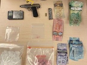 Kingston Police seized a loaded firearm and drugs found in the possession of two locals during an arrest on Tuesday.