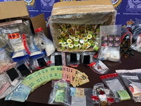 Various drugs and other items seized by the Kingston Police during two search warrant executions in Kingston, on Aug. 18. (Supplied Photo)