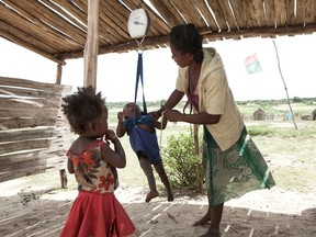 A woman checks the weight of her baby at a health centre in the village of Imongy in the Tsihombe district of southern Madagascar. Over 500,000 children under the age of five are expected to be acutely malnourished through April 2022.