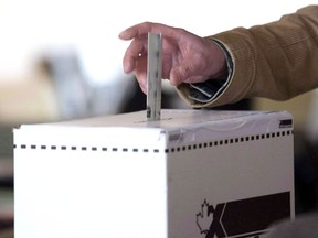 A voter casts a ballot in the 2011 federal electio.