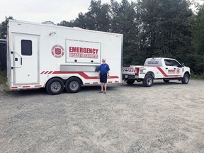 Robbie Donaldson, Salvation Army  Auxiliary Captain for Kirkland Lake and Timmins stands besides the north region's new emergency disaster services trailer.