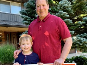 Perth-Wellington federal Liberal candidate Brendan Knight, along with his son William, stand behind an election sign last week after the Sept. 20 was officially called.