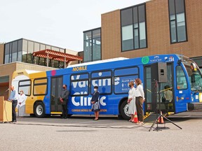 Representatives from the North Bay Parry Sound District Health Unit and City of North Bay unveil a new mobile vaccination clinic, Aug. 27, outside the health unit's office on Oak Street West. Michael Lee/The Nugget