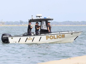 Members of the OPP underwater search and recovery unit head to Lake Erie out of South Side Landing Marina & RV Park in Erieau, Ont., on Sunday, Aug. 8, 2021. Mark Malone/Chatham Daily News/Postmedia Network
