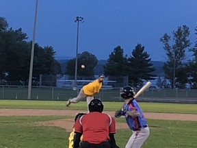 Pembroke A's pitcher Tommy Serran delivers a pitch to Chapeau's Ian Chalmers during Friday's night season opening game in the Ottawa Valley Men's Baseball League.  The A's defeated the Expos 7-1. Submitted photo