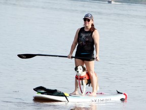 Jolien Hussick takes her pup Lexi for a spin on her stand-up paddleboard at the Petawawa Point before heading out for the Doggy Paddle, the Ontario SPCA Renfrew County Animal Care Centre fundraiser held Aug. 21.