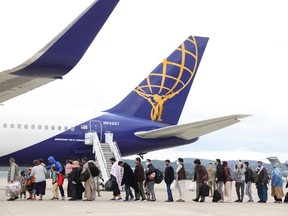 Evacuees board an Atlas aircraft bringing them from Afghanistan to the United States from the Ramstein Air Base on Aug. 26, in Ramstein-Miesenbach, Germany. Ramstein has become one of the main preliminary destinations for evacuees leaving Afghanistan on U.S. military flights. U.S. forces there have built a temporary shelter and are preparing to accept up to 10,000 people. Evacuations by a multitude of nations of their citizens and endangered Afghans are ongoing as the Taliban warned against extending foreign military presence in Afghanistan beyond Aug. 31.