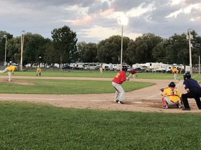 Pembroke A's pitcher Josh Brazeau throws a curve ball to Chalk River batter Pat Law during the second inning of the A's 10-4 win over the Cardinals on Monday night at Riverside Park in Pembroke.