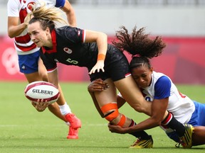 Canada’s Julia Greenshields of Sarnia, Ont., is tackled by France’s Anne-Cecile Ciofani during a preliminary-round game in women’s rugby sevens at Tokyo Stadium in the Tokyo Olympics on July 30, 2021. (REUTERS/Edgard Garrido)
