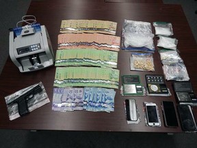 Three people have been arrested after Sarnia police say they seized nearly $97,000 in illegal drugs and more than $28,000 in cash from three locations throughout the city during a raid on Thursday, Aug. 5, 2021. (Sarnia police)