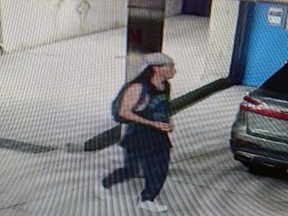 Lambton OPP are asking the public for tips after they say a "specialized" mountain bike was stolen in Point Edward. A photo of a suspect taken from surveillance footage walking in what appears to be a parking garage was included in a Tweet issued on Aug. 12, 2021. (Twitter)