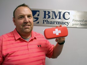 Marcel Laporte, a pharmacist at BMC Pharmacy, holds an overdose-reversing naloxone kit on Tuesday August 17, 2021 in Sarnia, Ont. Paul Morden/Sarnia Observer/Postmedia Network