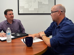 Alberta's Minister of Immigration and Labour, Jason Copping, left, speaks to Spruce Grove-Stony Plain MLA Searle Turton during a recent visit to the riding on Aug. 3. Turton welcomed Copping for a tour of several local businesses regarding economic recovery with a focus on the Alberta Jobs Now program.