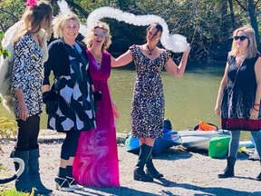 Tanya van Rooy,  Michele Storr, Rachel Heart,  Katherine Czerlau and Carole Aeschelmann, of Blue Herons in Ballgowns, get ready to paddle in Black Creek in Port Dover last October. The group, which also includes Annie Thibeault, Mandy Wood and Mel Guillette-Winger, is planning another paddle this year and is raising money for Haldimand and Norfolk Women's Services. CONTRIBUTED