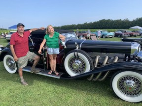 Doug and Julie Cadman of Courtland, ON. with their 1930 Dusenberg Torpedo Pheaton, which they brought to the American Luxury Car Show at Ramblin' Road Brewery Farm in La Salette on Saturday, August 28.