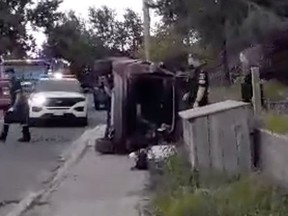 This vehicle end up on its side on a Melvin Street sidewalk folliowing a two-vehicle crash Monday afternoon. Video image