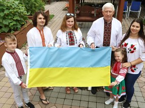 Andrii Manovych, 10, left, Pavlo Bozhyk, Marika Babiak, Taras Martyn, Solomia Manovych, 5, and Olesia Babiak will be taking part in a celebration to mark the 30th anniversary of Ukraine independence in Sudbury, Ont. on August 8, 2021. The event will be held at Camp Zaporizhia on Richard Lake. The celebration will include a flag raising, traditional music and a barbecue. John Lappa/Sudbury Star/Postmedia Network