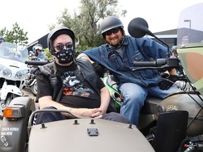 St. Joseph's Villa resident James Oman, left, got a chance to ride in a sidecar motorcycle with Pat Severin in Sudbury, Ont. on Thursday August 5, 2021. Oman's wish to ride in a sidecar was fulfilled thanks to the villa's Make a Wish Day. John Lappa/Sudbury Star/Postmedia Network
