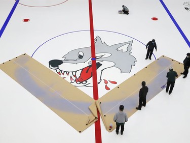 Lines were painted and the Sudbury Wolves logo was added as the ice surface started to take shape at the Sudbury Community Arena in Sudbury, Ont. on Friday August 6, 2021. John Lappa/Sudbury Star/Postmedia Network