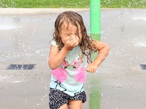 Ophelia Lepage, 3, cools off at the splash pad at the Kinsmen Sports Complex in Lively, Ont. on Monday August 9, 2021. John Lappa/Sudbury Star/Postmedia Network