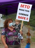 Tammy Amyotte and her grandson, Dominic, 1, take part in a protest with Onaping residents and supporters on Wednesday August 11, 2021. The group was protesting what they call a dangerous intersection on Highway 144 at Marina Road. John Lappa/Sudbury Star/Postmedia Network