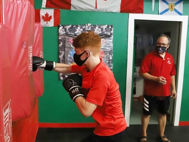 Owen Paquette, 16, a Quest for Gold athlete, competed in a series of physical challenges against Sudbury MPP Jamie West at Top Glove Boxing Academy in Sudbury, Ont. on Friday August 13, 2021. The Quest for Gold program is designed for athletes to achieve their goals. Paquette's goal is to represent Canada in the 2024 Olympic games. John Lappa/Sudbury Star/Postmedia Network