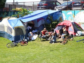 People gather at an encampment located at Memorial Park in Sudbury, Ont. on Monday August 16, 2021. John Lappa/Sudbury Star/Postmedia Network