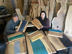 Timber Effects cofounders Zach Prosser and Kayla Pond create custom made live edge epoxy resin tables and other creations with locally sourced materials. Supplied photo)