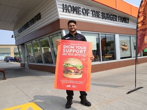 Rabinson Raju, A&W area manager, promotes the annual Burgers to Beat MS Day in Sudbury, Ont. on Thursday August 19, 2021. A&W Canada is donating $2 from every Teen Burger sold on Aug. 19. John Lappa/Sudbury Star/Postmedia Network