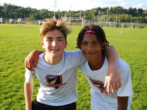 Braxton Ragogna, left, and Luca Cucullo,  of GSSC  U14 boys, praise the Impact's determination and teamwork. The club heads to Toronto for two games this weekend in Central Soccer League action. Laura Young