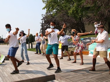 Arjun Shukla, left, leads a dance at a rally at Tom Davies Square in Sudbury, Ont. on Friday August 20, 2021. Fridays For Future Youth joined forces with Save Laurentian University Greenspace, Save Wolf Lake, and the Sudbury Chapter of the International Physicians for the Prevention of Nuclear War, to mark the third anniversary of Greta Thunberg's first school strike for the climate. John Lappa/Sudbury Star/Postmedia Network