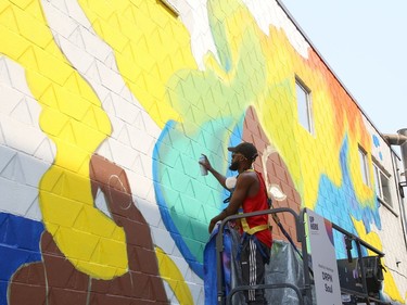 DRPN Soul works on his mural on Medina Lane for the Up Here urban art and music festival in Sudbury, Ont. on Friday August 20, 2021. The festival runs until Aug. 22. John Lappa/Sudbury Star/Postmedia Network