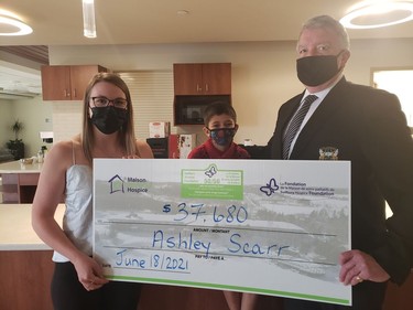 Ashley Scarr was the winner of the Maison McCulloch Hospice's monthly 50/50 draw in June. In the photo are Ashley Scarr, Kiran and Gerry Lougheed Jr. Supplied