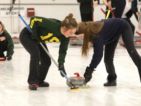 Lockerby Vikings skip Kira Brunton shouts instructions to her team mates Jessica Leonard and Abby Deschene as they sweep her stone during high school curling city championship action in Sudbury, Ont. on Wednesday February 15, 2017. Deschene is expecting a busy 2021-22 season. Gino Donato