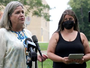 Sacha Coutu looks on as Ontario NDP leader Andrea Horwath speaks in Wildwood Park in Bright's Grove on Aug. 10. Both were calling for reduced class sizes in Ontario to help guard against COVID-19 spread in schools. Tyler Kula/Postmedia Network