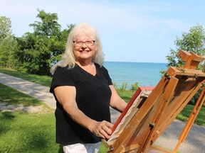 Painter Sharon Ormerod sets up her easel near Lake Huron in Bright's Grove where she lives. One of Omerod's paintings, Big Thunder, won first prize in this year's Floyd Gibson Exhibition at the Lawrence House Centre for the Arts in Sarnia.Paul Morden/Postmedia Network