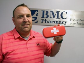 Marcel Laporte, a pharmacist at BMC Pharmacy, holds an overdose-reversing naloxone kit. Paul Morden/Postmedia Network