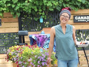 London entrepreneur Laura Bradley holds a plate of French toast during Sunday brunch at Behind the Bend, a cannabis consumption cafe located behind her marijuana retail store on Main Street in Grand Bend. Dale Carruthers/Postmedia Network