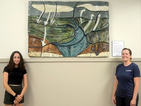 A new piece of artwork, called A Watershed of Clay, was installed at Arkona Lions Museum and Information Centre, at Rock Glen Conservation Area in Arkona, in August. Shown with the artwork, from left, are University of Guelph School of Engineering researcher Hannah May, and Nina Sampson, conservation educator with Ausable Bayfield Conservation Authority. The clay ceramic art was created by artist Andrea Piller. This art and science project was funded by Guelph Institute for Environmental Research (GIER) and the Food from Thought program. Handout