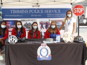 Timmins Police Service youth ambassadors, from left, Aleah Miller, Brooke Gauthier, Sidney Del Guidice, Kira McGee and the coordinator Alexa Madore, were out at the Urban Park Market on Thursday to educate young members of the community about bicycle safety. 

RICHA BHOSALE/The Daily Press
