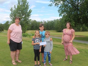 Lorrie O'Connor is with the Byers children and Emily Lamarche of L & E Industrial Laundry who's company made a generous donation which will assist the local Jr. Golf program.