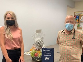 Abbigail Tremblay, the Physician Recruiter with Worker Bees and Dr. McGuire at the Cochrane Family Health Team with the Welcome Basket donated by A&G Freshmart in Matheson.